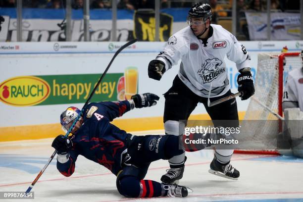 Milan Jurcina of Nuernberg Ice Tigers vies Keith Aucoin of Red Bull Munich during 37th Gameday of German Ice Hockey League match between Red Bull...