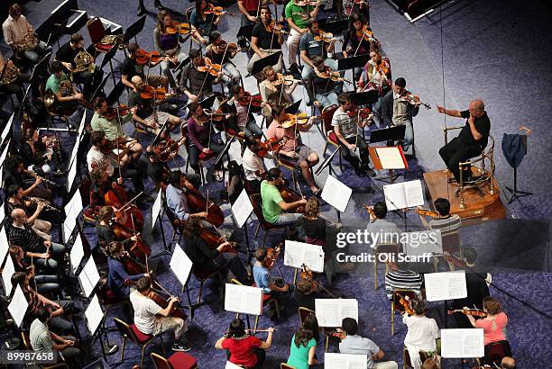 Musicians of The West-Eastern Divan youth orchestra, conducted by Daniel Barenboim , rehearse in the Royal Albert Hall ahead of their performance in...