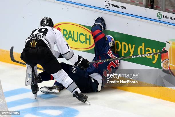 John Mitchell of Nuernberg Ice Tigers vies Keith Aulie of Red Bull Munich during 37th Gameday of German Ice Hockey League match between Red Bull...