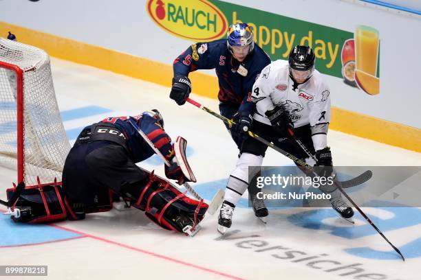 Keith Aulie of Red Bull Munich vies Dane Fox of Nuernberg Ice Tigers during 37th Gameday of German Ice Hockey League match between Red Bull Munich...