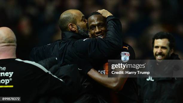 Nuno Espirito Santo, Manager of Wolverhampton Wanderers celebrates at the final whistle by kissing Willy Boly of Wolves during the Sky Bet...