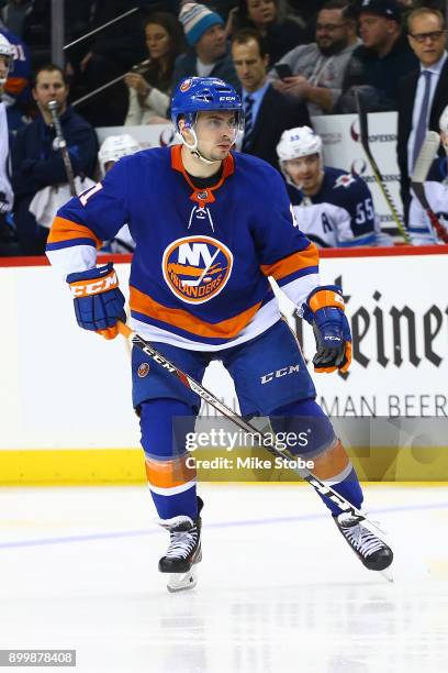 Shane Prince of the New York Islanders skates against the Winnipeg Jets at Barclays Center on December 23, 2017 in New York City. New York Islanders...