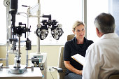 A woman listens to her opthamologist