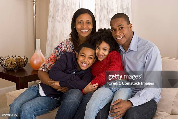 family in livingroom - jamaican ethnicity imagens e fotografias de stock