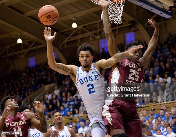 Mfiondu Kabengele of the Florida State Seminoles fouls Gary Trent Jr of the Duke Blue Devils during their game at Cameron Indoor Stadium on December...