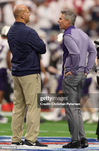 Head coaches James Franklin of the Penn State Nittany Lions and Chris Petersen of the Washington Huskies talk before the start of the Playstation...