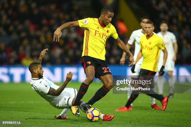 Watford's Marvin Zeegelaar gets tackled by Swansea City's Luciano Narsingh during Premier League match between Watford and Swansea City at Vicarage...