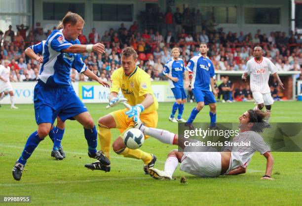 Enrico Kern and Alexander Walke of Rostock battles for the ball with Huezeyfe Dogan of Berlin during the Second Bundesliga match between 1. FC Union...