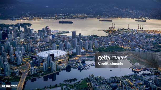 bc place and science world with cityscape - vancouver canada stock pictures, royalty-free photos & images