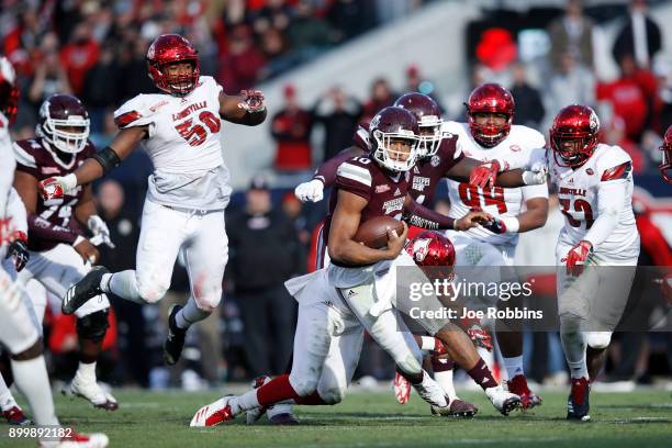 Keytaon Thompson of the Mississippi State Bulldogs runs the ball in the fourth quarter of the TaxSlayer Bowl against the Louisville Cardinals at...