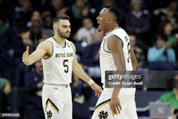 Matt Farrell and Bonzie Colson of the Notre Dame Fighting Irish react in the second half against the Georgia Tech Yellow Jackets at Purcell Pavilion...