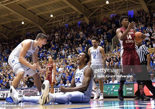 Grayson Allen and Wendell Carter Jr of the Duke Blue Devils react after Carter drew a charging foul against Trent Forrest of the Florida State...