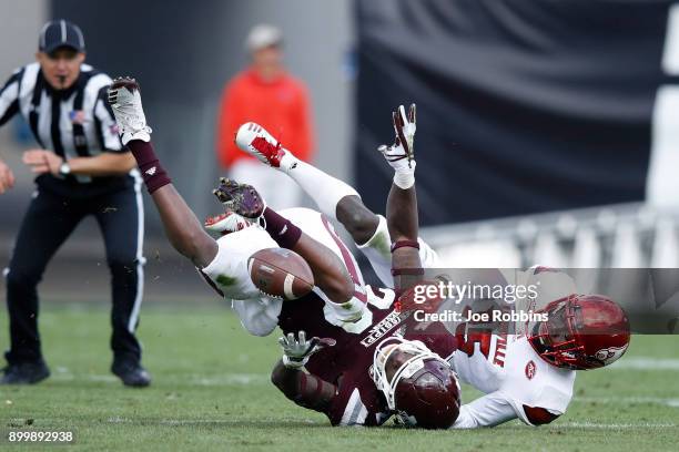 Trumaine Washington of the Louisville Cardinals breaks up a pass intended for Reginald Todd of the Mississippi State Bulldogs in the third quarter of...