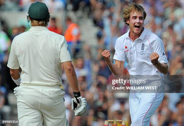 England paceman Stuart Broad celebrates dismissing Australian batsman Shane Watson on the second day of the fifth and final Ashes cricket Test match...