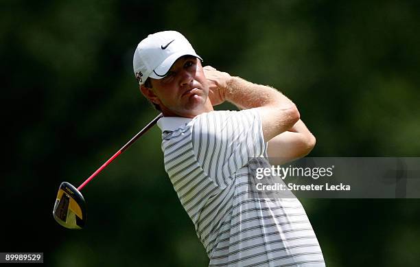 Lucas Glover watches his tee shot during the second round of the Wyndham Championship at Sedgefield Country Club on August 21, 2009 in Greensboro,...