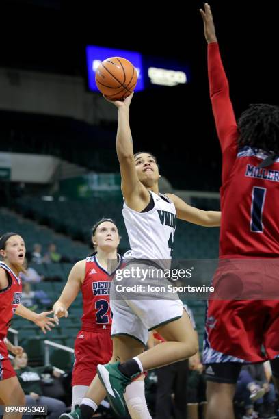 Cleveland State Vikings guard Mariah White shoots over Detroit Titans forward Ashley Miller during the fourth quarter of the women's college...