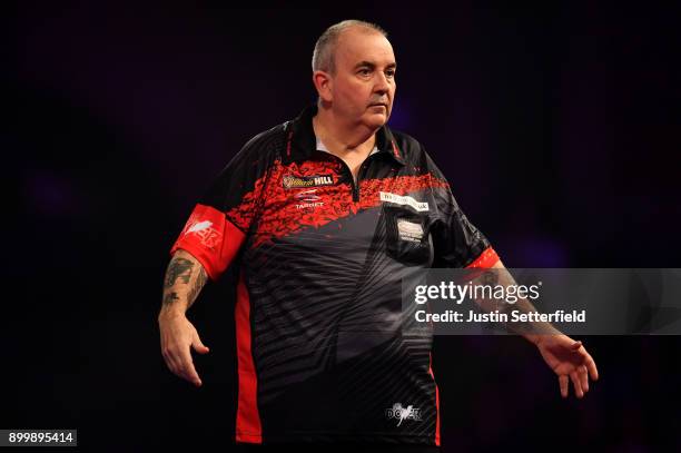 Phil Taylor reacts during his Semi Final Match against Jamie Lewis during the 2018 William Hill PDC World Darts Championships at Alexandra Palace on...