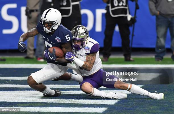 DaeSean Hamilton of the Penn State Nittany Lions scores a touchdown on a 48 yard reception during the first quarter while being tackled in the...