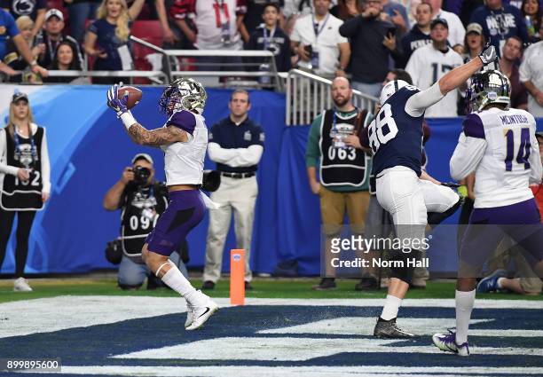 Byron Murphy of the Washington Huskies intercepts a pass in the back of the endzone against the Penn State Nittany Lions during the Playstation...