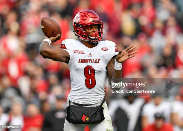 University of Louisville Cardinals quarterback Lamar Jackson throws a pass from the pocket during the second half of the TaxSlayer Bowl game between...