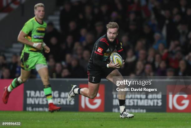 Charlie Walker of Harlequins breaks clear to score a try during the Aviva Premiership Big Game 10 match between Harlequins and Northampton Saints at...