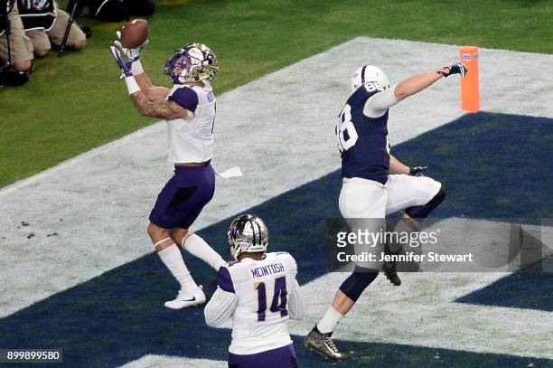 Defensive back Byron Murphy of the Washington Huskies makes an interception touchback against tight end Mike Gesicki of the Penn State Nittany Lions...