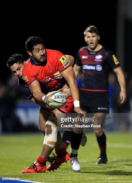 Sean Maitland of Saracens and Alafoti Faosiliva of Worcester Rugby compete for the ball during the Aviva Premiership match between Saracens and...