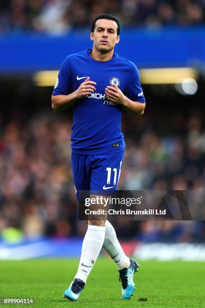 Pedro of Chelsea in action during the Premier League match between Chelsea and Stoke City at Stamford Bridge on December 30, 2017 in London, England.