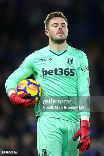 Jack Butland of Stoke City looks dejected during the Premier League match between Chelsea and Stoke City at Stamford Bridge on December 30, 2017 in...