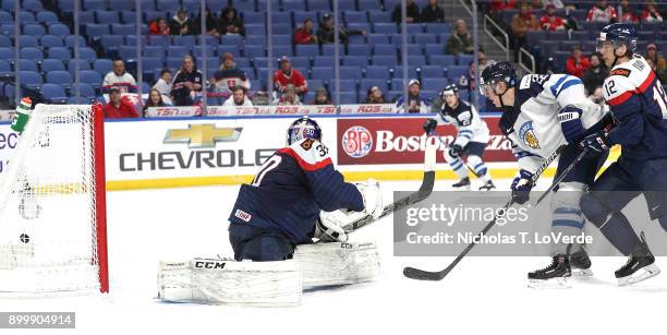 Aapeli Räsänen of Finland tipped a shot past Roman Durny of Slovakia to give Finland a 2-1 lead during the second period of play in the IIHF World...