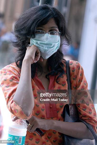 Girl wears a protection mask in Ram Manohar Lohia Hospital in New Delhi on Thursday, August 20, 2009. The national capital reported its first Swine...