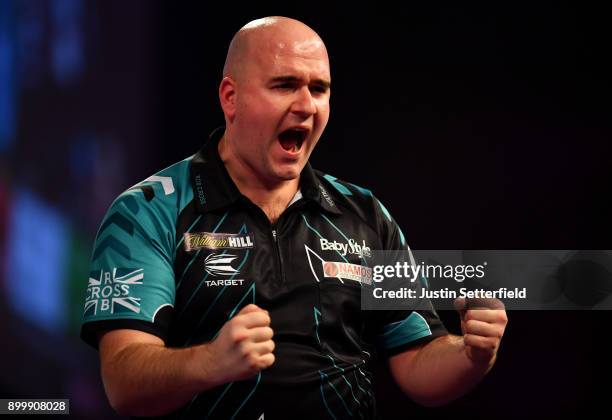 Rob Cross celebrates during his Semi Final Match against Michael van Gerwen during the 2018 William Hill PDC World Darts Championships at Alexandra...