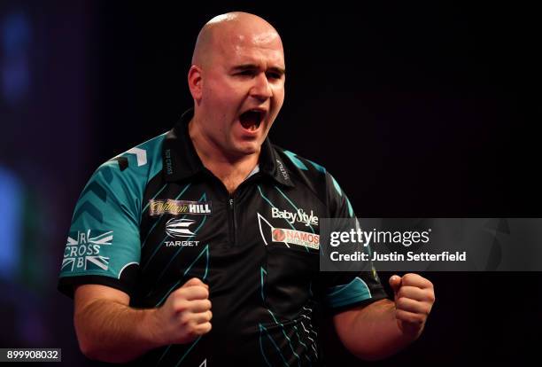 Rob Cross celebrates during his Semi Final Match against Michael van Gerwen during the 2018 William Hill PDC World Darts Championships at Alexandra...