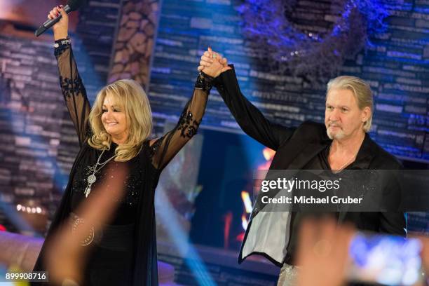 Singer Bonnie Tyler and Singer Johnny Logan performs together during the New Year's Eve tv show hosted by Joerg Pilawa on December 30, 2017 in Graz,...