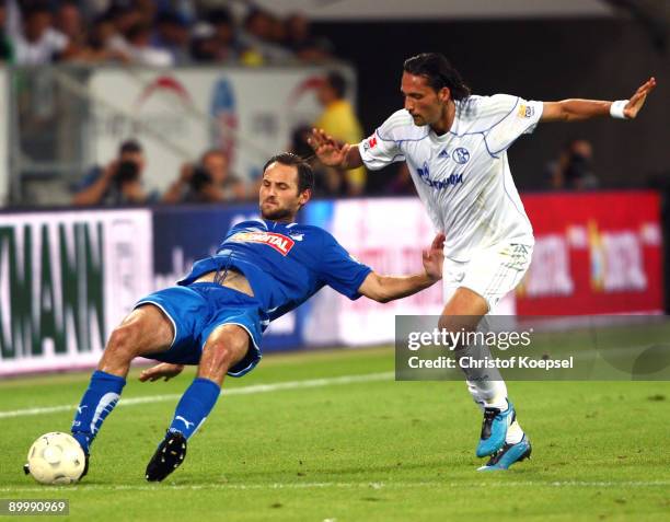 Kevin Kuranyi of Schalke tackles Josip Simunic of Hoffenheim during the Bundesliga match between 1899 Hoffenheim and FC Schalke 04 at Rhein-Neckar...