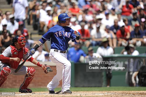 Josh Hamilton of the Texas Rangers bats during the game against the Boston Red Sox at Rangers Ballpark in Arlington in Arlington, Texas on Sunday,...