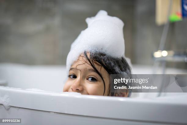 what is real bath time without the bubbles - bathtub stock-fotos und bilder