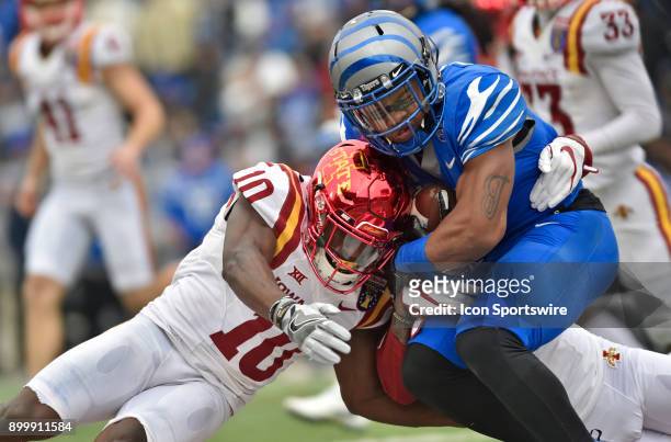 Memphis Tigers kick returner Tony Pollard is wrapped up by an Iowa State defender and defensive back Brian Peavy during the second quarter during the...