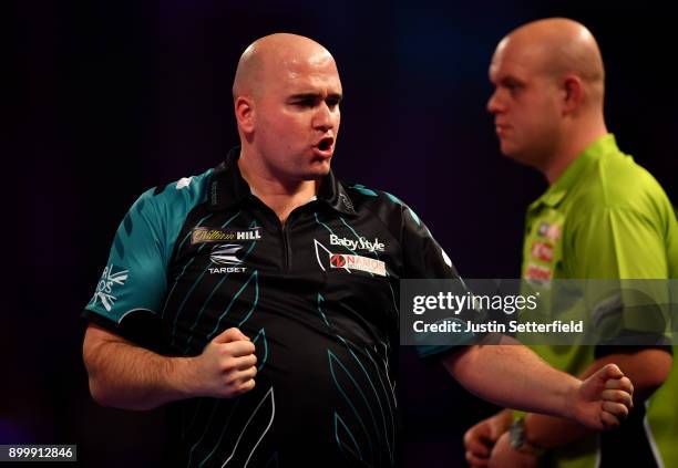 Rob Cross celebrates during his Semi Final Match against Michael van Gerwen during the 2018 William Hill PDC World Darts Championships at Alexandra...