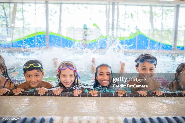 swimming practice - swimming lessons stock pictures, royalty-free photos & images