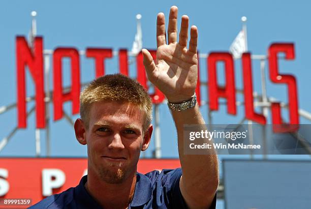 Stephen Strasburg, the overall first pick in the 2009 Major League Baseball draft, waves to fans as he takes part in a press conference where he was...