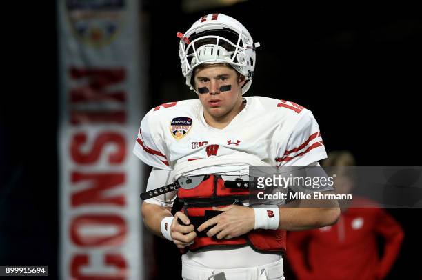 Alex Hornibrook of the Wisconsin Badgers warms up during the 2017 Capital One Orange Bowl against the Miami Hurricanes at Hard Rock Stadium on...