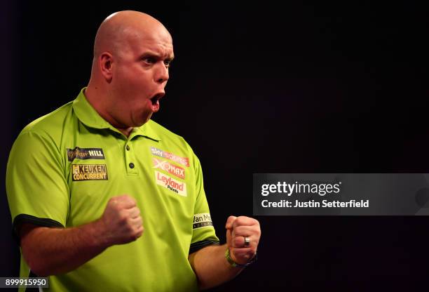 Michael van Gerwen celebrates during his Semi Final Match against Rob Cross during the 2018 William Hill PDC World Darts Championships at Alexandra...