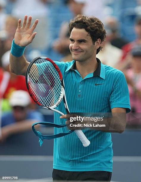 Roger Federer of Switzerland waves to the crowd after defeating Lleyton Hewitt of Australia during day five of the Western & Southern Financial Group...