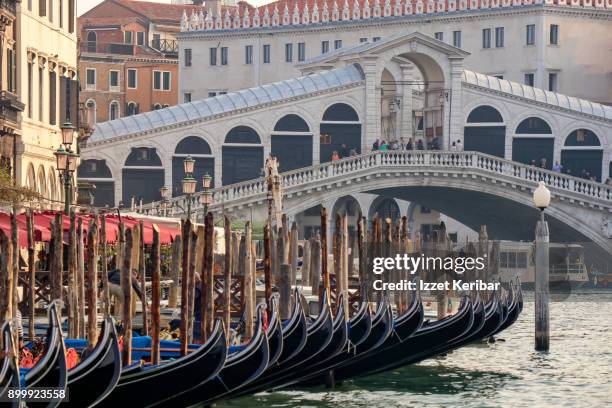 gondolas moored near rialto bridge, venice italy - リアルト橋 ストックフォトと画像