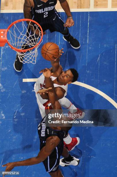 Hassan Whiteside of the Miami Heat goes up for a rebound against the Orlando Magic on December 30, 2017 at Amway Center in Orlando, Florida. NOTE TO...