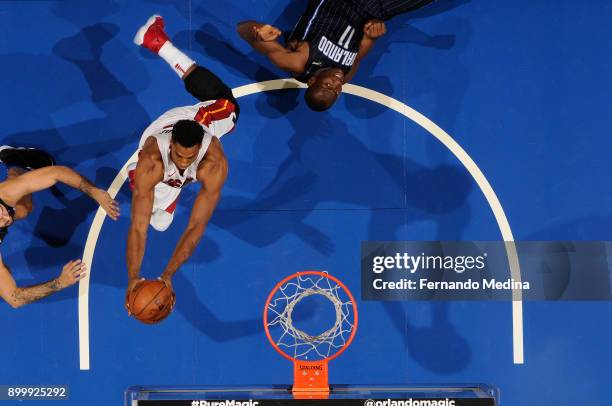 Hassan Whiteside of the Miami Heat goes up for a rebound against the Orlando Magic on December 30, 2017 at Amway Center in Orlando, Florida. NOTE TO...