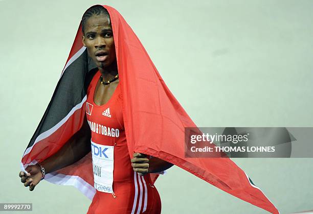 Trinidad and Tobago's Renny Quow celebrates placing third in the men's 400m final race of the 2009 IAAF Athletics World Championships on August 21,...