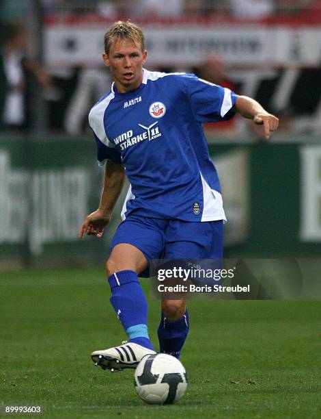 Kevin Schoeneberg of Rostock runs with the ball during the Second Bundesliga match between 1. FC Union Berlin and Hansa Rostock at the stadium An der...