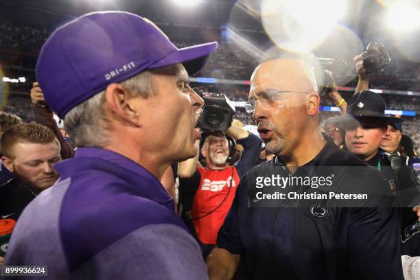 Head coaches James Franklin of the Penn State Nittany Lions and Chris Petersen of the Washington Huskies shake hands following the Playstation Fiesta...